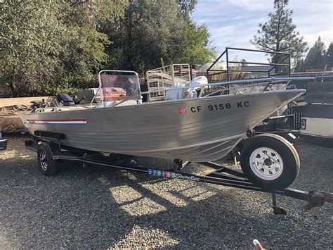 15 FT Welded Aluminum Fishing Boat-Wide Body 56 - Splash Well And Reinforced Aluminum Transom -Like New-Just Payed registration - Have New 2025 Tags In Hand -Stability in this Boat is excellent - Easily stand And Fish- Due To Wider body style -15 HP Johnson 2 Stroke Motor - Run Great- Purchased. . Gregor boats